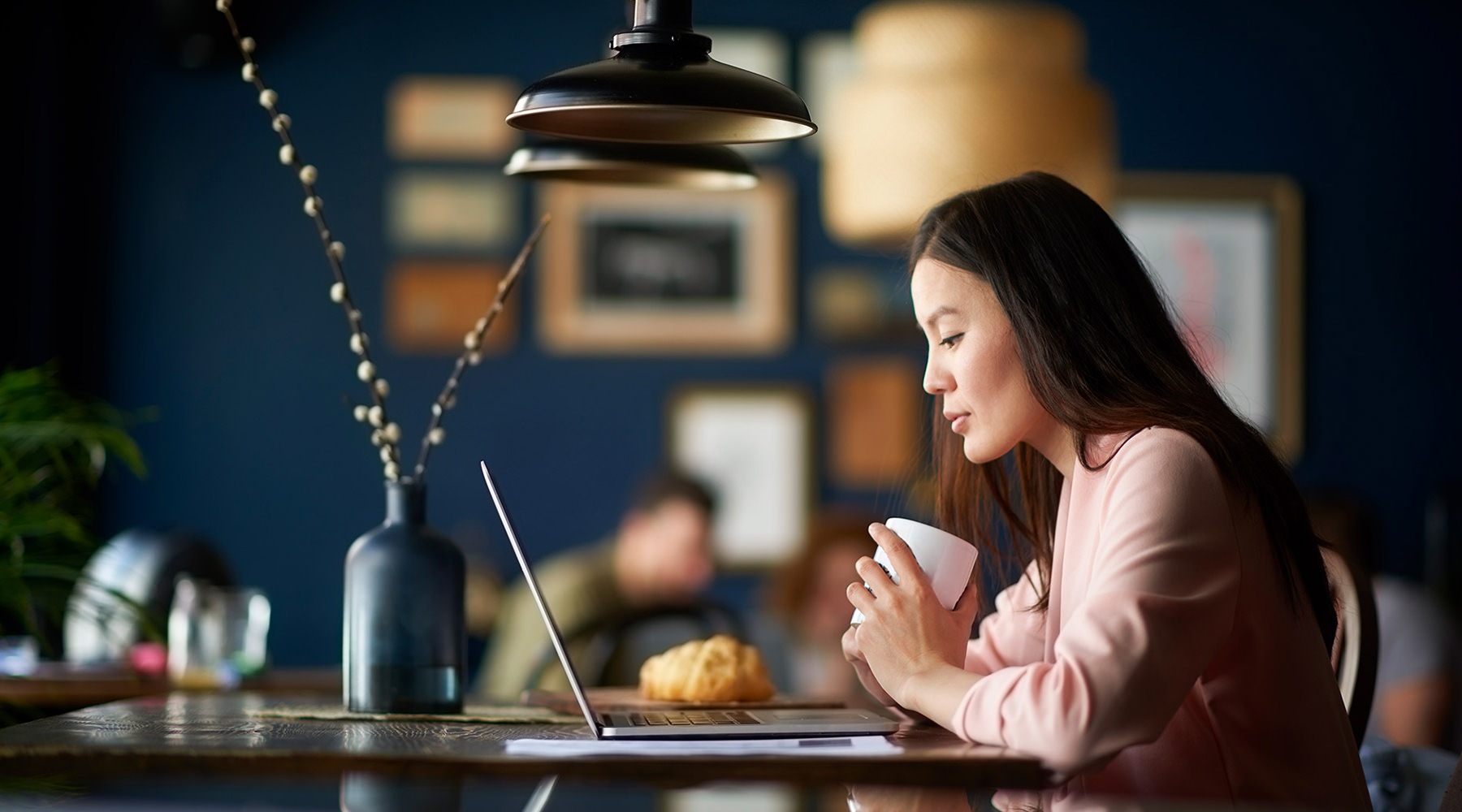 Cafe Woman sitting in a cafe on her computer