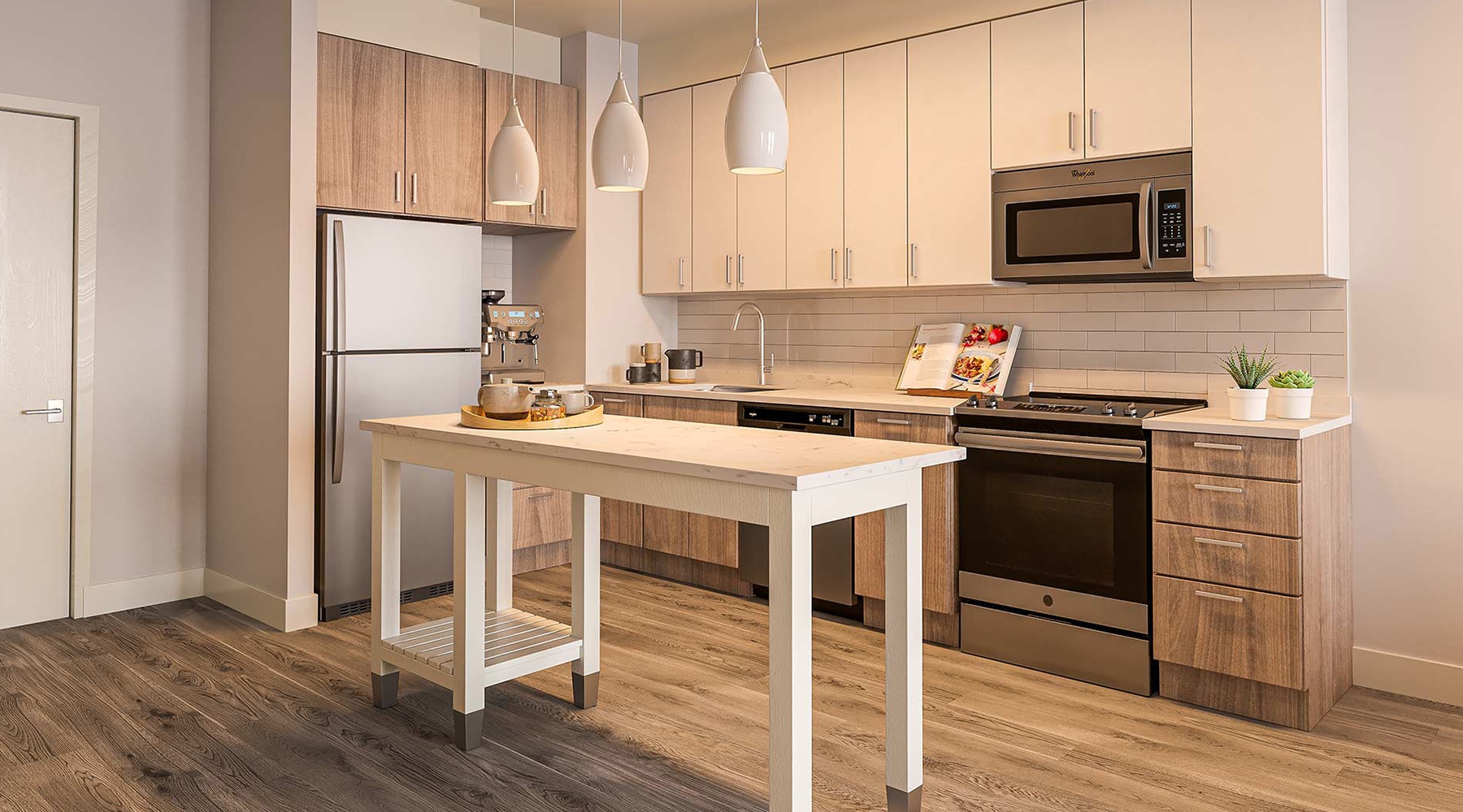 Kitchen Spacious and well lit kitchen with wood floors and stainless steel appliances