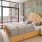 Spacious and well lit bedroom with plush carpet and large windows