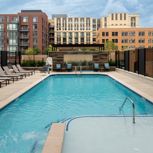 Pool gated, swimming pool with lounge chairs